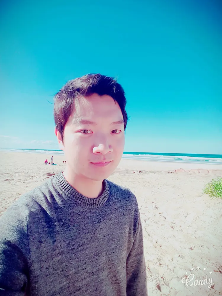 Jeremy Oh on a beach in Australia